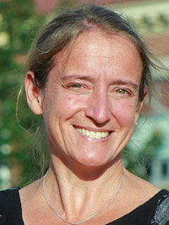 Dr. Nili Kaplan-Myrth, seen from the neck up, smiling
