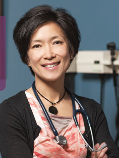 Dr. Thuy-Nga (Tia) Pham, seen from the chest up, wearing a stethoscope around her neck, short black hair, and smiling 