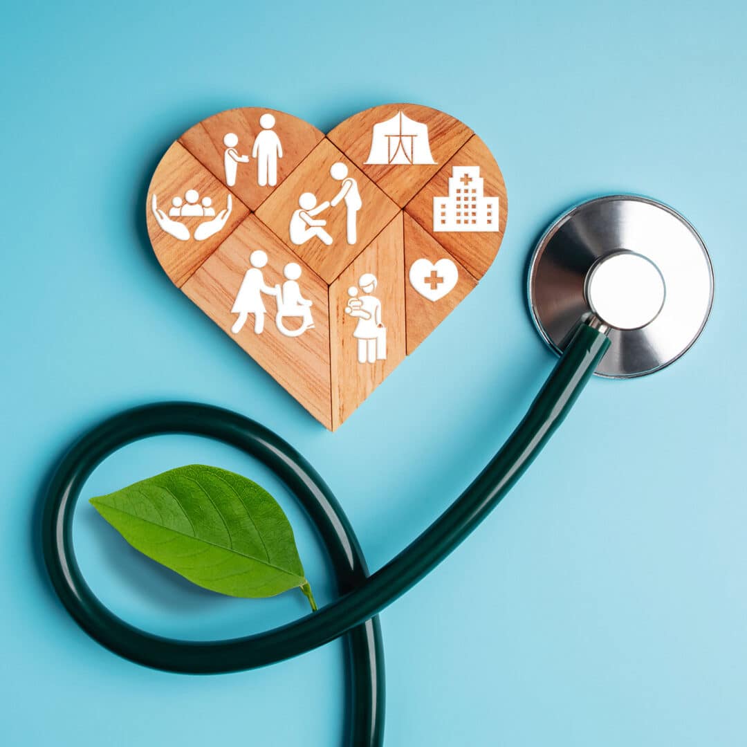 A blue background with a wood heart puzzle and a stethoscope on top. White icons, representing health equity, are shown on each puzzle piece.